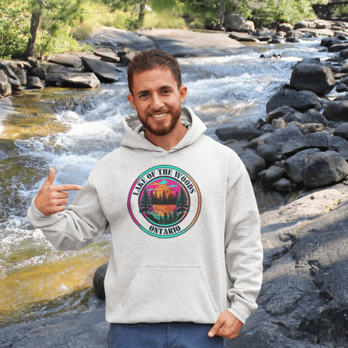 Featuring a stunning lake scene with a vibrant sunset, this hoodie captures the beauty of Lake of the Woods in Ontario, where tranquil waters meet the warm glow of a setting sun.